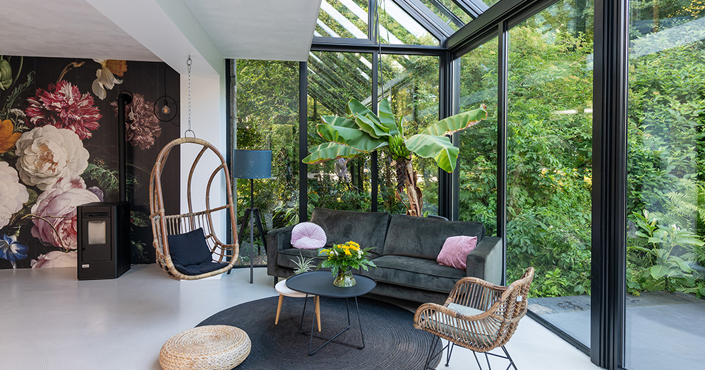Screened-in porch with comfortable seating and an open view of the yard