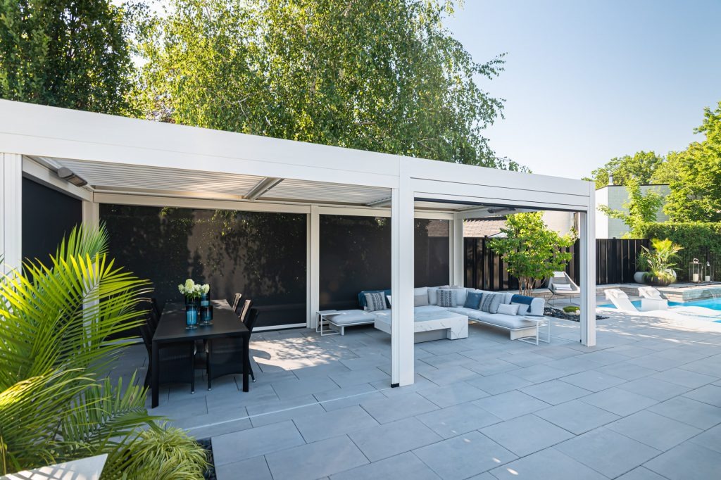 Poolside patio with exterior shades for added protection from sun and insects