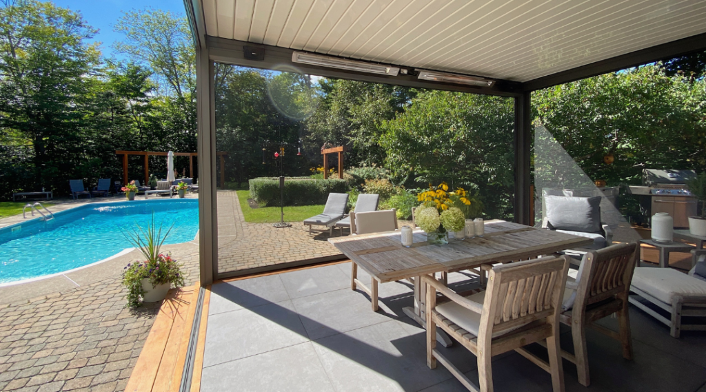 Screened porch with outdoor furniture arranged for relaxing and entertaining