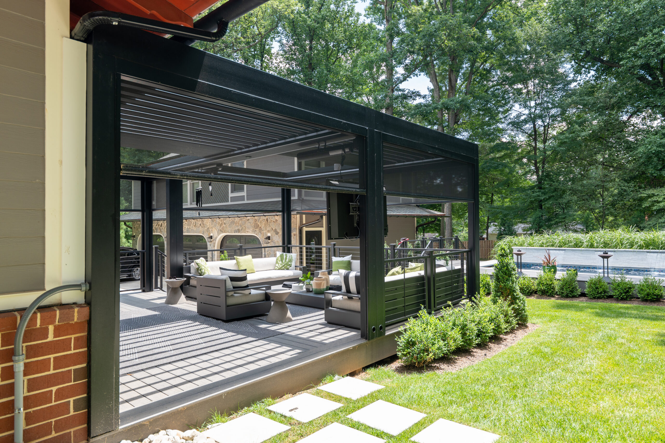 Screened-in porch addition connected to the back of a home