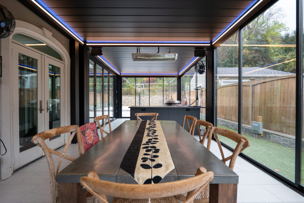 Screened porch with an outdoor dining area for family meals