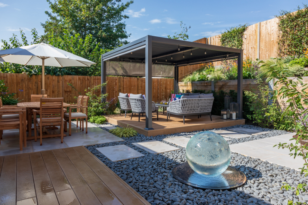 Outdoor patio with separate lounging and dining areas